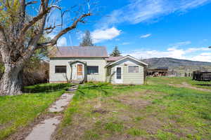 Bungalow-style house featuring a mountain view and metal roof