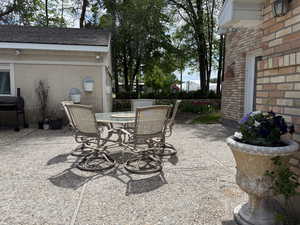 View of patio / terrace with outdoor dining area and a grill