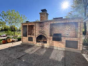 View of patio / terrace featuring a fireplace