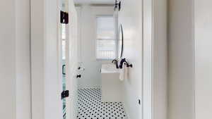 Bathroom with a sink and tile patterned floors