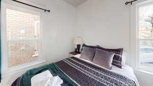 Bedroom with multiple windows