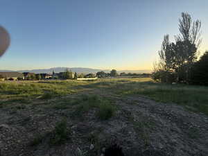 View of yard featuring a view of countryside and a mountain view