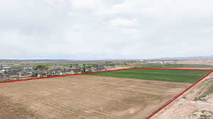Aerial view of residential area featuring property boundaries highlighted