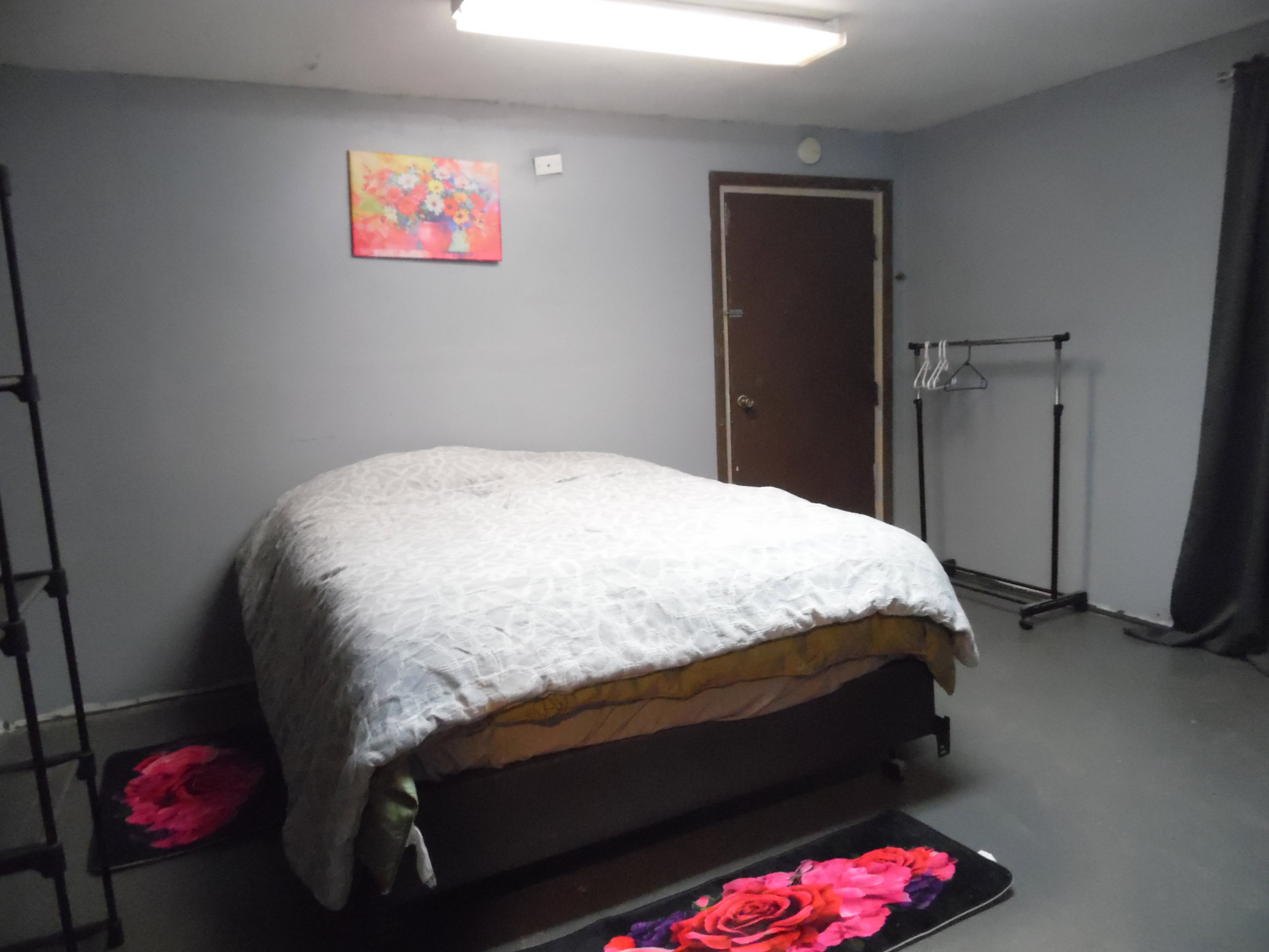 Bedroom featuring concrete flooring