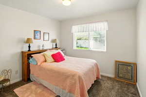 Bedroom with carpet and baseboards