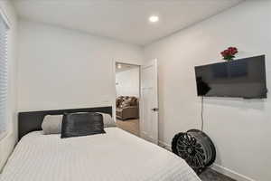 Bedroom featuring baseboards and recessed lighting