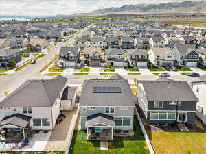 Aerial perspective of suburban area featuring a mountainous background