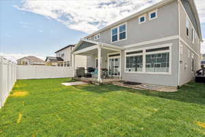 Back of property featuring stucco siding and a patio area