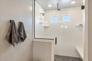 Full bath featuring a shower stall