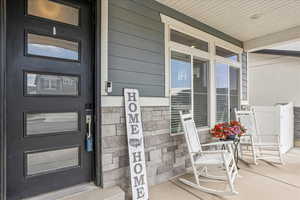 Property entrance featuring a porch