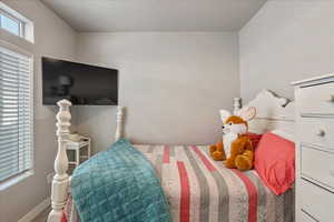 Bedroom with baseboards