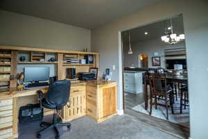 Office featuring a chandelier