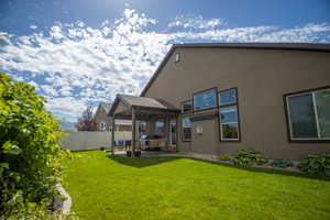 Back of house featuring a patio and stucco siding