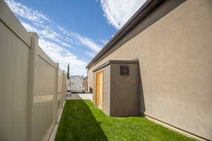 View of side of home with stucco siding