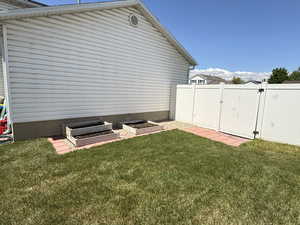 View of yard with a gate
