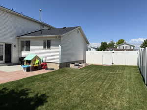 Rear view of property with a patio area