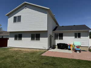 Back of property with a patio area