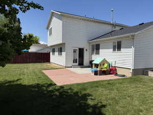 Rear view of house featuring a patio area