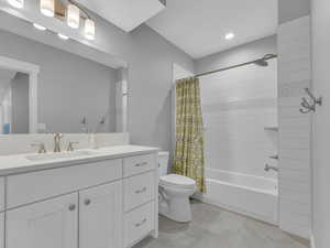 Full bath featuring vanity, toilet, shower / bath combination with curtain, and recessed lighting