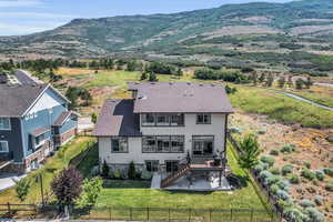 Drone / aerial view with a mountain view and open space next door