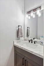 Bathroom featuring vanity and toilet