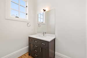apartment Bathroom with baseboards and vanity