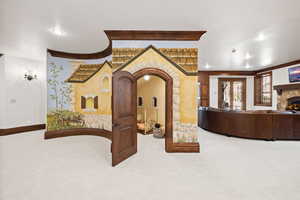Hallway featuring carpet flooring, crown molding, baseboards, and recessed lighting