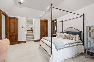 Bedroom featuring visible vents and light carpet