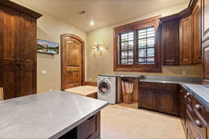 Clothes washing area featuring cabinet space, washer / dryer, visible vents, recessed lighting, and light carpet