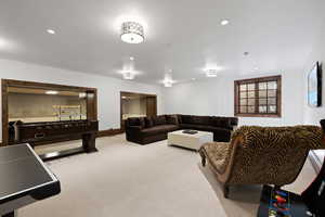 Living room with carpet and recessed lighting