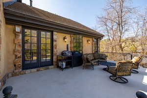View of patio / terrace with an outdoor hangout area, french doors, and grilling area