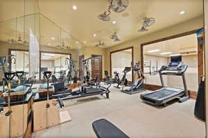 Exercise room featuring recessed lighting and carpet floors