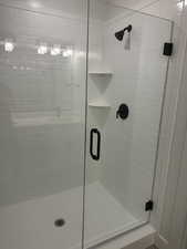 Full bath with a shower stall