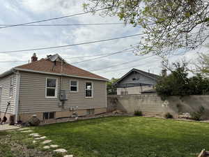 Rear view of house with roof with shingles