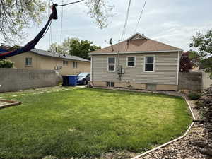 Back of property with roof with shingles