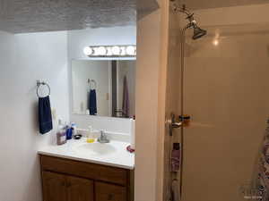 Full bathroom with vanity and a shower