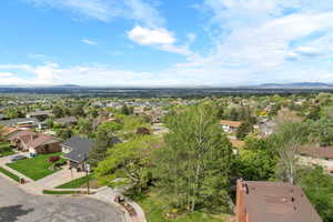 Aerial perspective of suburban area with a mountainous background