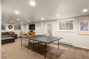 Game room with carpet floors, recessed lighting, and baseboards