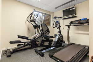 Workout room with a drop ceiling - can also be a bedroom