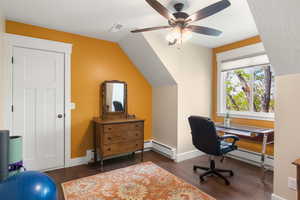 Bedroom with synthetic walnut floors, a ceiling fan, and lofted ceiling