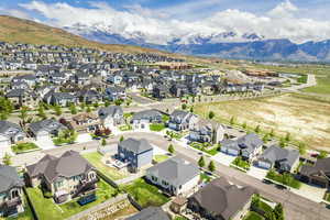 Aerial perspective of suburban area with a mountain backdrop