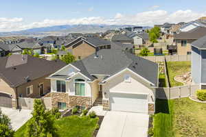 Aerial perspective of suburban area featuring a mountain backdrop