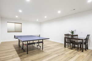 Rec room featuring light wood-style floors, recessed lighting, and baseboards