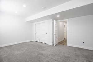 Below grade area featuring carpet, baseboards, and recessed lighting