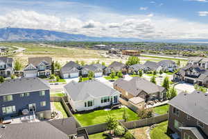 Aerial view of residential area featuring a mountainous background
