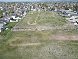Aerial view of property's location with nearby suburban area