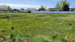 View of yard featuring fence