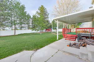 View of yard featuring a wooden deck