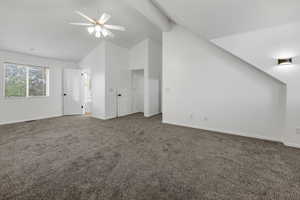 Primary bedroom with high vaulted ceiling