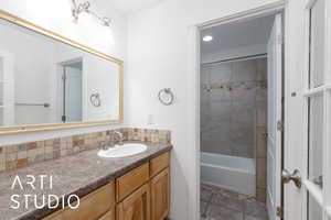 Full bath with vanity and shower / bathtub combination